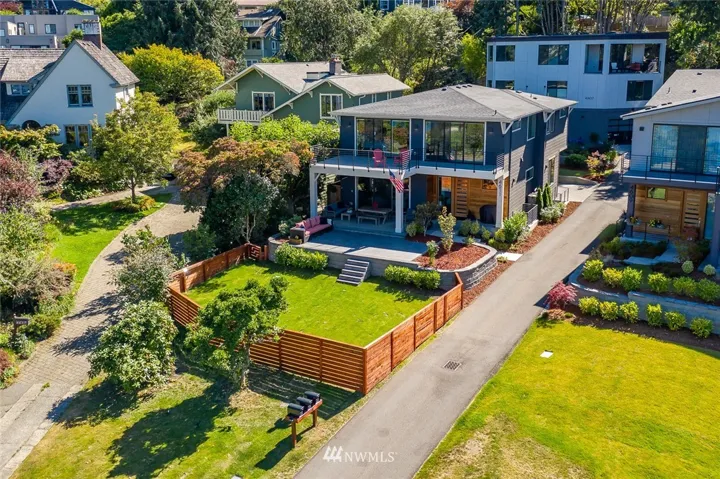 A RARE location just blocks to Seward Park and sited across the street from Lakewood Marina. Notice the long driveway to the attached garage and the entertainment deck & patio.