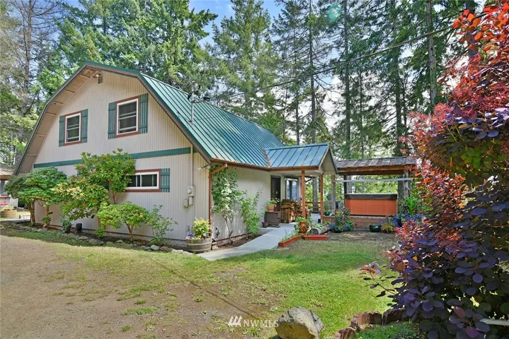 Welcome home -- this comfortable home will delight you with over an acre of property and views of beautiful Hood Canal too.