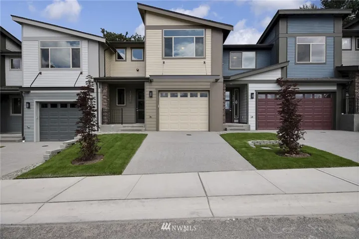 3 Panel Glass front doors with covered patio welcomes you home.  Park in your garage or driveway - it all belongs to you!