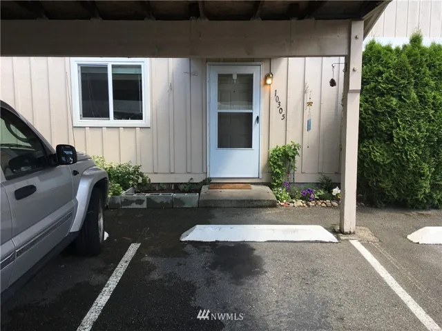 Main entrance with covered parking