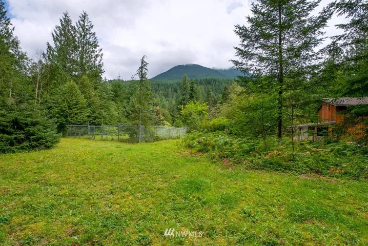 Why is this the first picture --- This property offers multiple building sites and a house that can be renovated -- But the beauty is in the land..... 2/3 meadow and buildable and 1/3 awesome NW forest with natural trails.