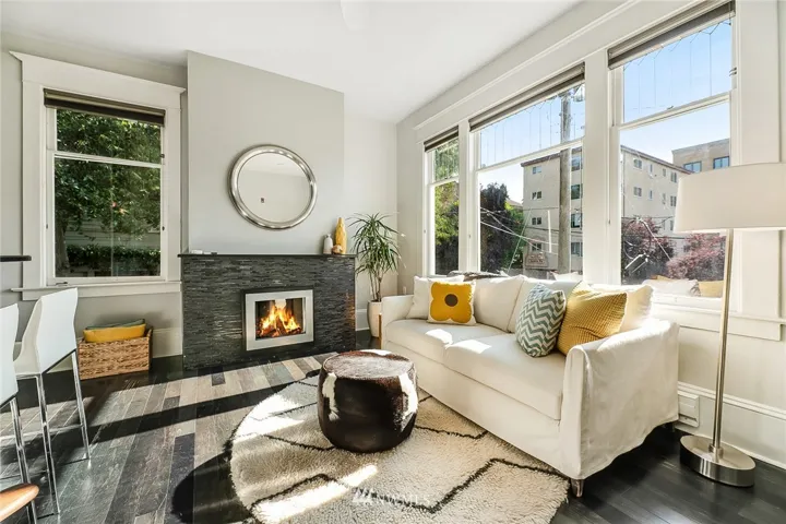 West facing windows and a stylish electric fireplace