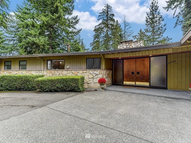 Double front doors welcome you and open to an elegant entry of granite and stone. Double doors make your move easier