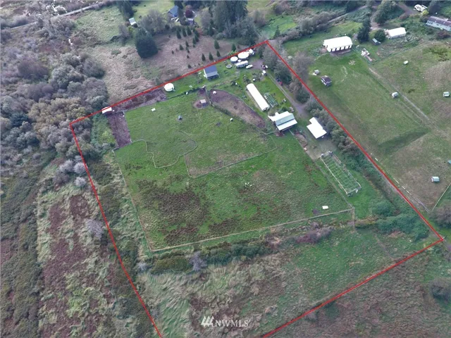 ROUGH outline of the property boundaries. Chimacum creek runs through the lower left to upper left of property line. barn, homes shops all located upper right.