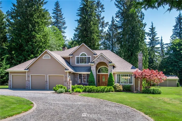 Beautiful 2 story with circular driveway, arched brick entry & 3 car garage.