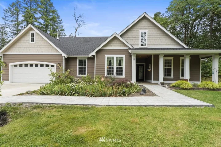 Welcome home to single level living on over an acre in charming Lakebay.