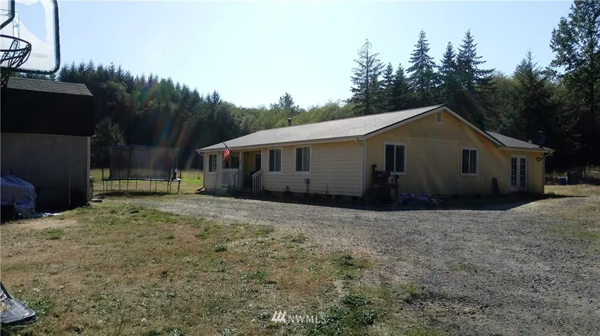 Front of home with parking and access to the shed.  Back french doors are to the office/sitting room.