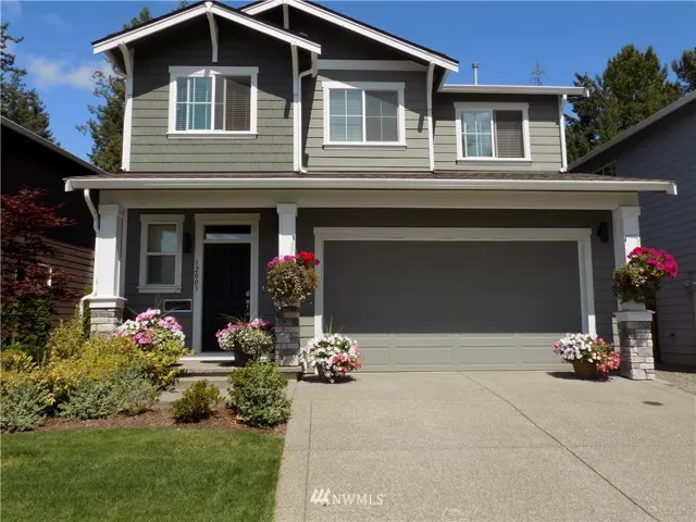 Attractive 4 bedroom home backs to the greenbelt in Emerald Point.  There is a den on main floor and an upstairs loft that is the second living room.