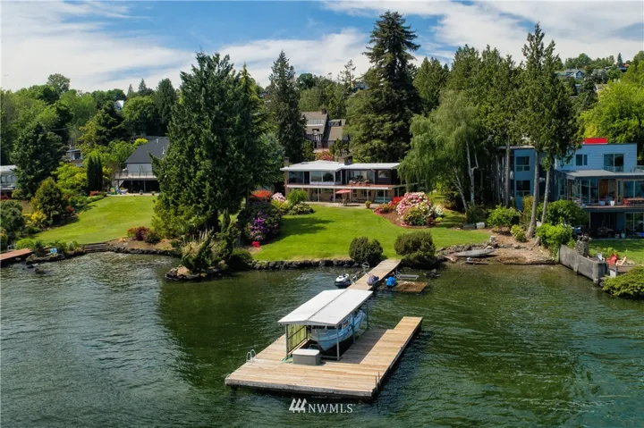 Lush, tranquil 1.12acre lot with 100' prime low bank waterfront in exclusive enclave in Seward Park. Oaklawn Pl is part of a large 3+ acre estate originally platted in 1890. This is one of the largest lots carved out when the original parcel was subdivided circa 1953. This is the very last stop on the lane, an arboretum-style setting with old growth cedars, colorful native rhododendrons, azaleas and other large established Pacific Northwest species. It is a rare and beautiful slice of historic Seward Park and Seattle located near enough to urban life to be convenient, but out of the way enough to be a hidden haven of peace and quiet.