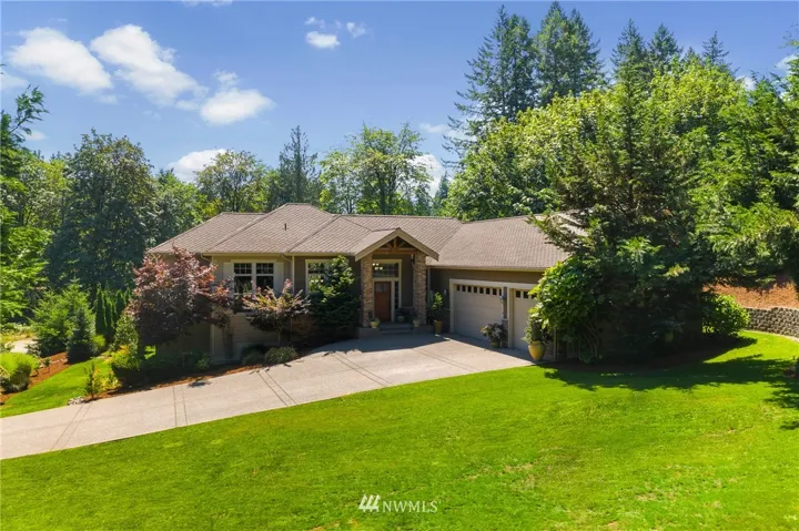 Picturesque and private, this stunning 3,672 SF home was thoughtfully designed with luxury in mind, and is nestled on an impeccably landscaped 1 acre lot just minutes from the best amenities that Gig Harbor has to offer.