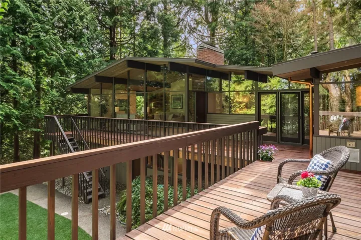 Large party-ready deck over looks backyard.