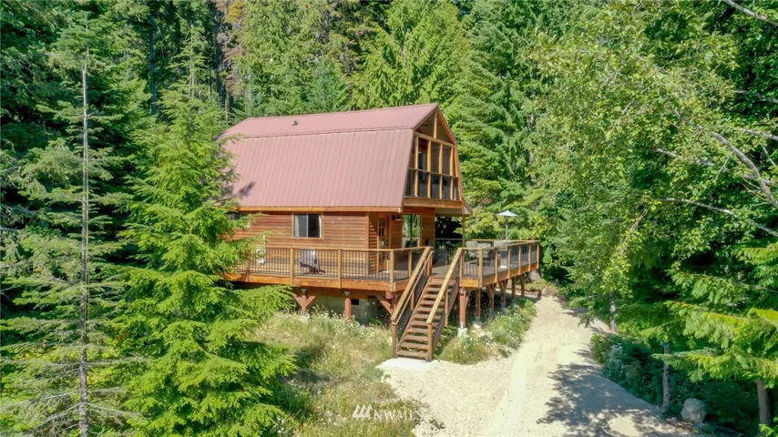 This darling cabin is nicely tucked in the trees for that true "Cabin in the woods feeling"
