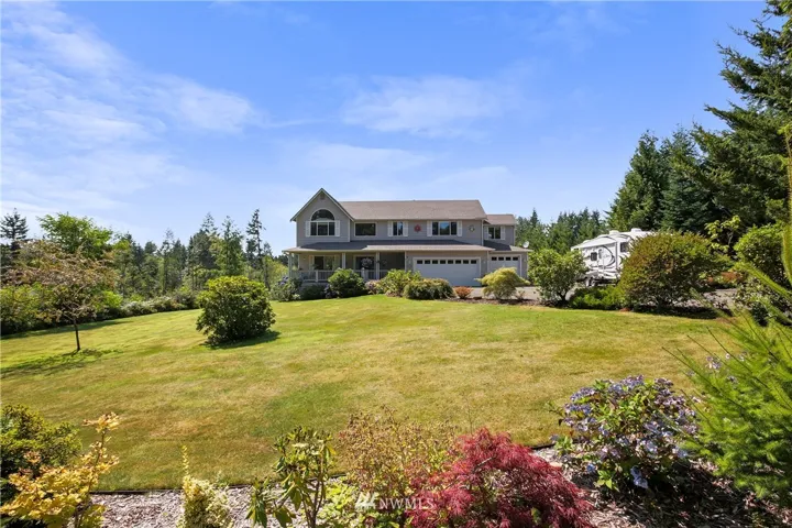4 bedroom spacious home on 2.47 acres- some lovingly landscaped and some natural