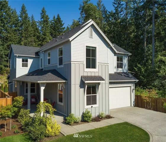 Situated on a corner lot with private driveway, the east side faces trees and is fairly private.