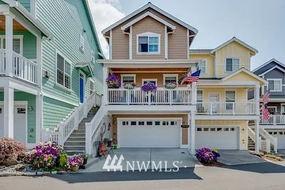 This Beautiful downtown Poulsbo home is just steps from downtown! Wonderful layout with 9' ceilings, spacious kitchen with slab granite counters and farm sink, decorator textures and colors throughout! Move in and enjoy low maintenance living today!