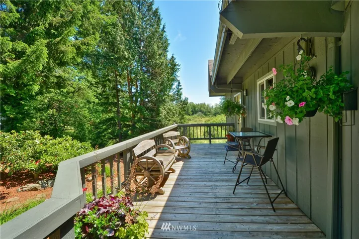Upper deck offers serene views of property and a relaxing place to start or end the day.