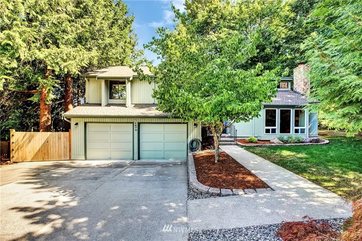 This lovely home is located at the end of a culdesac, in a private, wooded setting.  The driveway offers ample room for several cars to park in addtional to the garage parking for two cars.  The home is beautifully updated and lives comfortably with gas heat and AC!  New roof  (7/2019) too!
