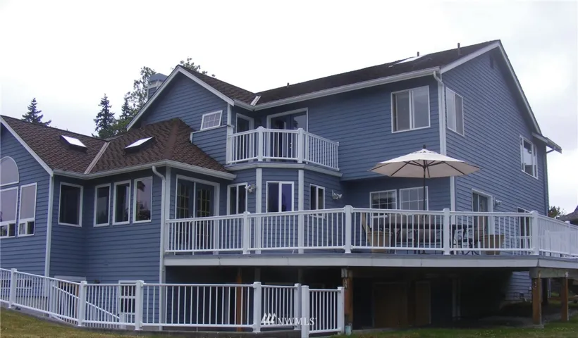 Large deck with multiple access points create a beautiful setting for your outdoor enjoyment.  Note the private deck upstairs.  What a perfect retreat.