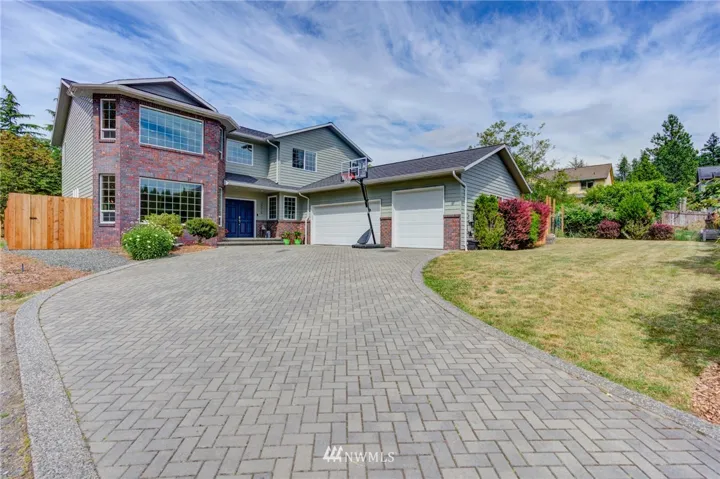 Silver Beach home with grassy front yard and secluded, fully fenced back yard. Oversized third garage bay accommodates boat or large vehicle.