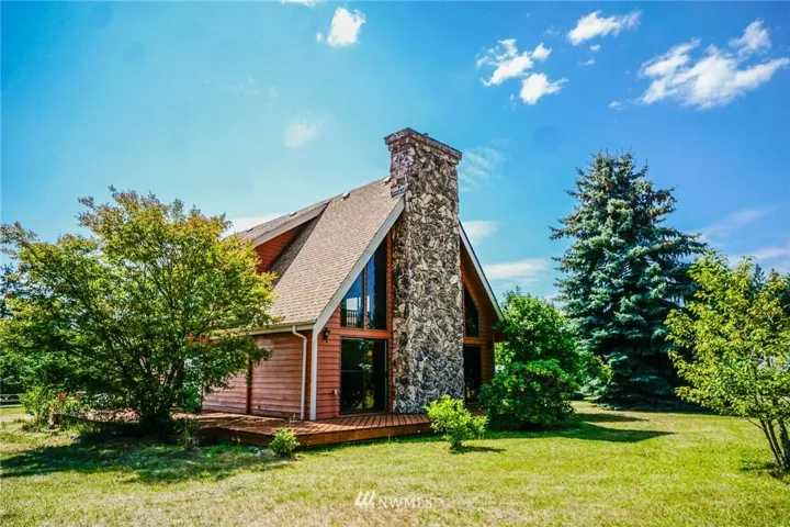 An expansive deck wraps the home, from the north corner around to the south. The perfect spot to enjoy your morning coffee as you watch the sun rise, or a cool lemonade in the afternoon once the sun has passed overhead.