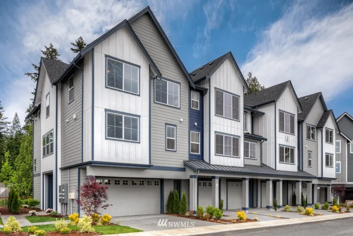 This space lives like a single family home!  Upon entry, you have a bedroom w/ a 3/4 bath on the first floor, with a 2 car side by side garage and 2 parking spaces in your driveway!  HUGE kitchen and very open living space - lovely finish + AC!