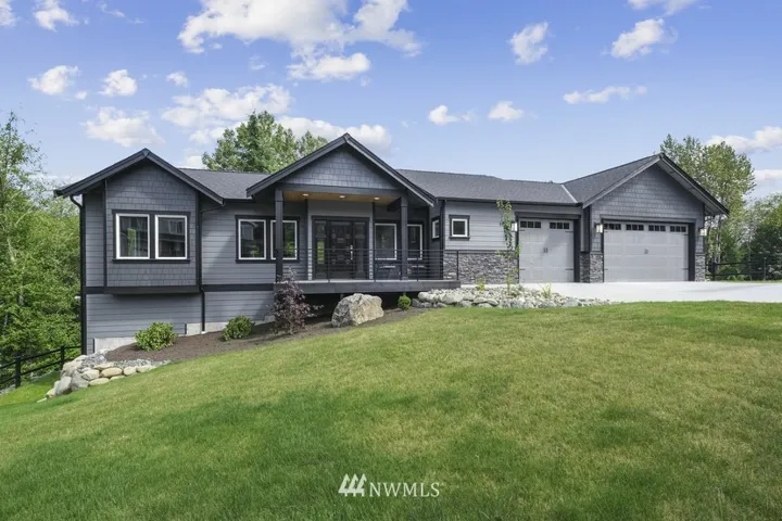 Luxury 4,100 SF 4 Bedroom 4 Bathroom Home - So Many Upgrades throughout! Handicap Accessible– Master Suite on MAIN FLOOR!!!This front door is pure knotty alder, stained and semi-gloss lacquered, includes two sidelights with smoky shady obscure glass. Highest quality and workmanship. The large 3 car garage has a separate large room in the back with a door & windows. Could be shop, office, or storage.