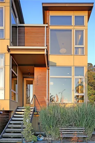 This end unit maximizes views and natural light with floor to ceiling triple pane glass windows.  Fully fenced yard shown here.