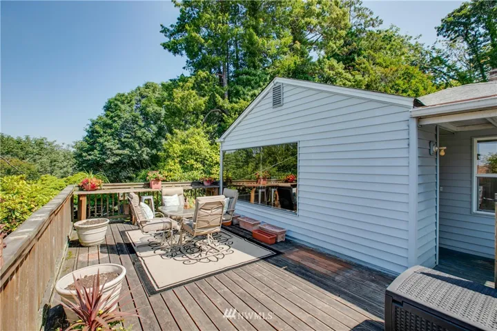 Enter your new home via the large front deck that has wonderful views of the Olympics and Sound.