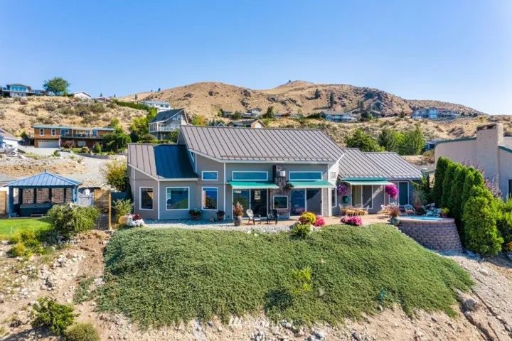 Welcome to 206 Orchard View Drive, overlooking Lake Chelan with unobstructed 180 degree views, community waterfront access, parks and pools (one just 3 blocks away from this home).  Easy living with one-level open concept design.