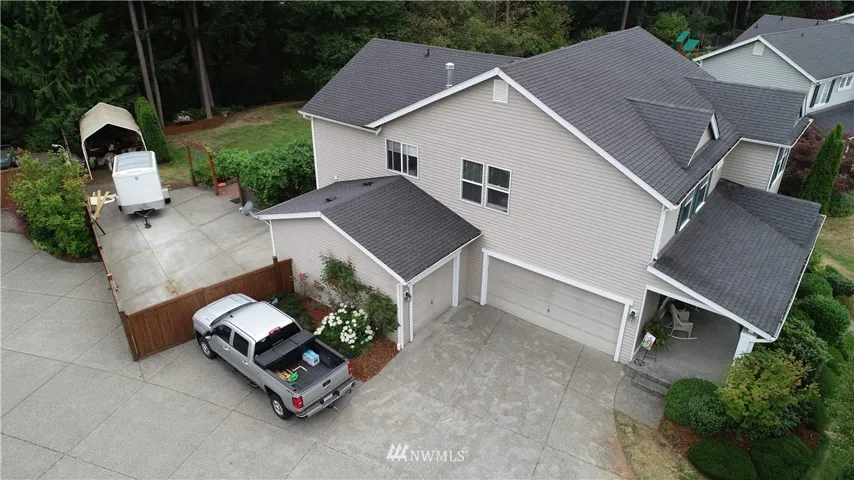 2 car plus separate one car garage and great RV parking. And it all backs up to a private greenbelt.