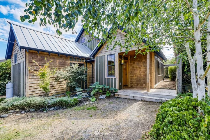 Quintessential Cottage in heart of Port Townsend comes complete with a Courtyard.  Design reflects indoor/outdoor living.  Raised planter beds.  Lovely perimeter landscape waiting to be rejuvenated.