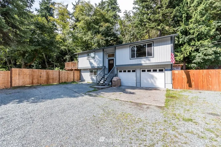 Enjoy peaceful country living with peek-a-views of Similk Bay just across Gilbralter Road.  Plenty of off-road parking, in addition to the 2-car garage with cement parking pad and easy access to large side-yard through double gates to house your RV/Boat, using just a portion of the LARGE 15,682 square foot property!