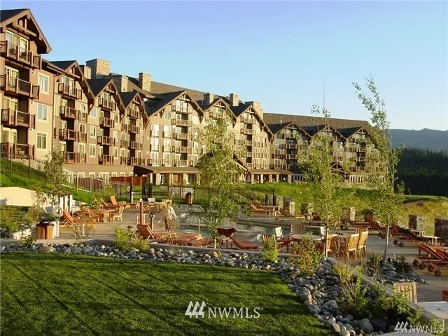 View of the back side of the Lodge, with the pool. Western sun keeps everyone warm until late in the day