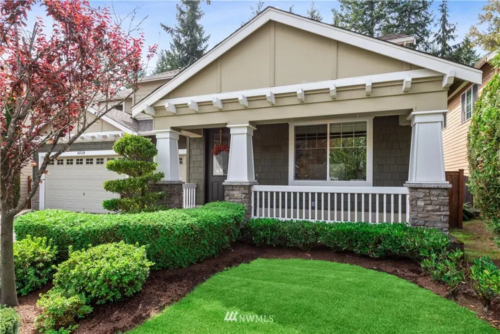 Enjoy sunny summer or crisp fall mornings from the cozy east facing front porch.  Front window is to the den.