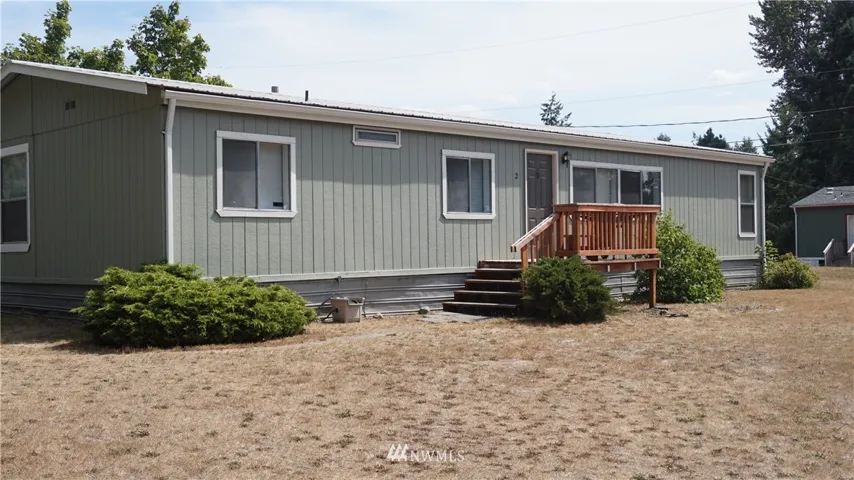 Freshly painted double wide with a sizable yard!