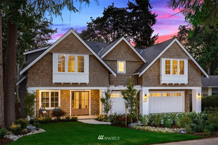 Lovely Hampton's inspired design with real cedar shake siding and exquisite detail work on the front and back elevation. The back of the home is as elegant as the front. Extensive landscaping, makes the home look like it has been here for years.