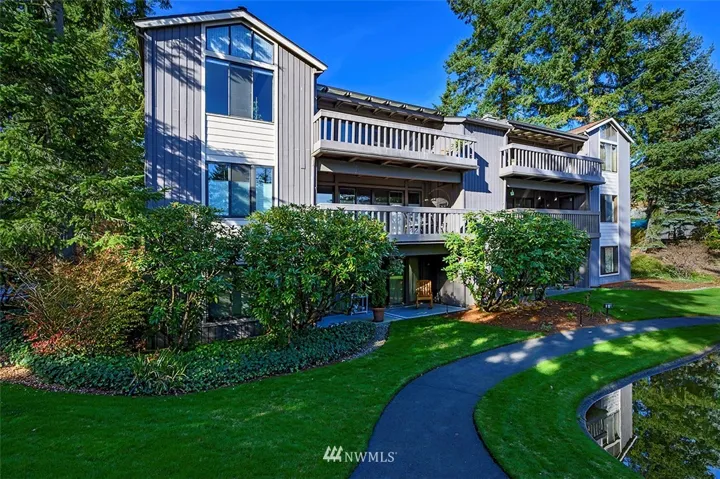 Beautifully updated one-level condo is the middle unit on left.  The gorgeous landscaped grounds and walking paths are an unexpected bonus of Noble Firs Condominiums.