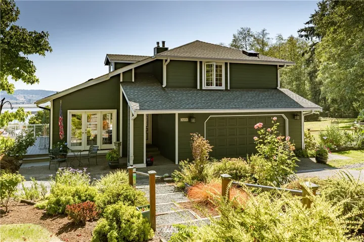 Welcome to this lovely home overlooking Useless Bay and surrounded by great outdoor living spaces and English-type gardens.