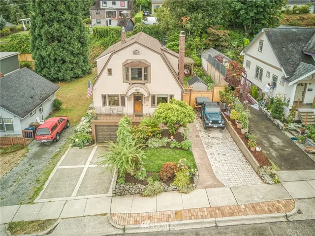 Welcome Home to this Dutch Colonial with new driveways &  french drain installed within the last 3 years by current owner