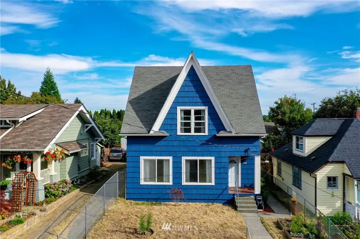 Fresh exterior paint looks great on this 1905 cutie!  Fully fenced front and side yard with gardens space.