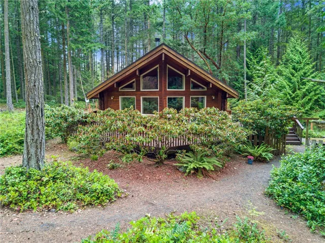 Nestled among the trees, this quaint & adorable 2-bedroom, 1-bath home is a peaceful haven.