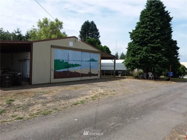 Large parking area in front of the shop/home. Also 2 covered parking areas besides inside the shop.