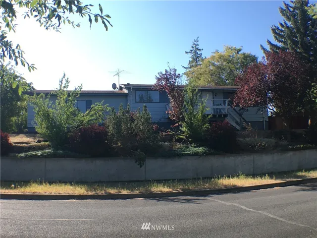 Large house on 2 city lots.  2 bedroom 2 bathrooms, with basement, & attached 2 car garage.  Deck and fenced backyard.