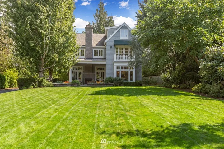 Welcome to 3233 Evergreen Point Rd - a rare classic masterpiece in Medina on a 2-level lot. This custom built home features a private driveway off Evergreen Point Rd, a large level flat lot with a huge yard surrounded by trees, and a lower level part of the property near the lake, with shared dock & covered boat lift.