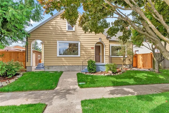 Charming tudor home near 6th Ave District. Your low maintenance yard has a sprinkler system, never have to go outside to water or move your sprinkler around.