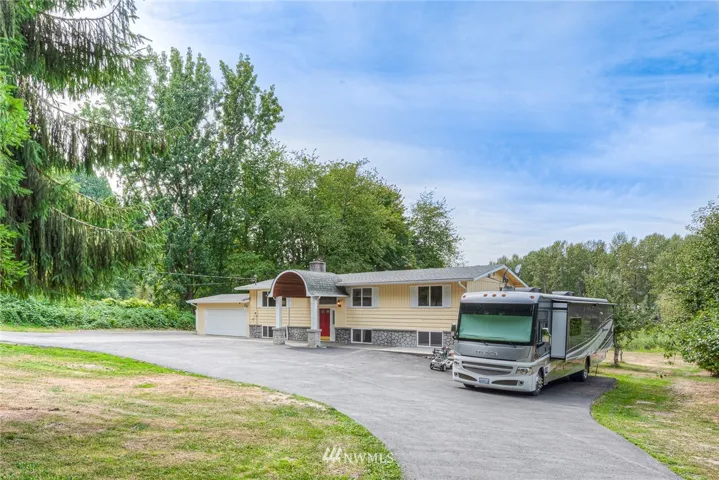 Welcome home! Circular driveway. RV pad with 50 amp service.
