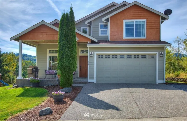 Hardie plank siding, 3 car (1 side tandem) garage, fruit trees and garden space! Make this yours!