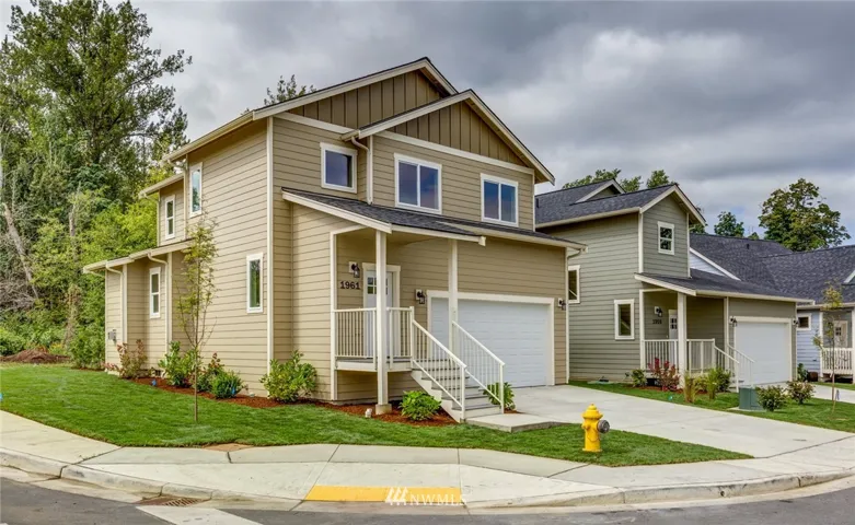 This home has great curb appeal on a corner lot abutting a greenbelt.