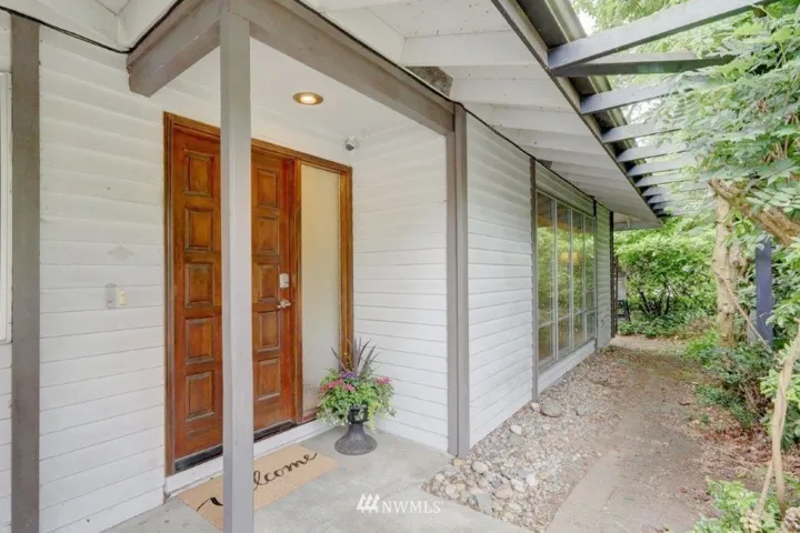 Front entrance with private courtyard and side entrance to fenced backyard