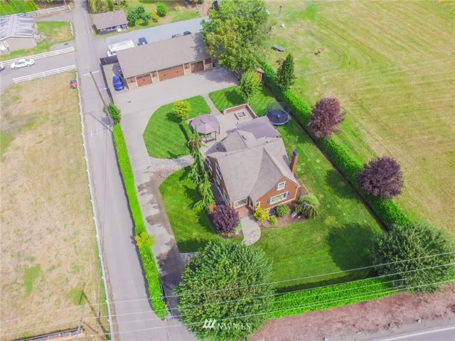 Welcome to this almost half-acre estate in the beautiful Puyallup Valley just 2 miles from the train station and downtown!